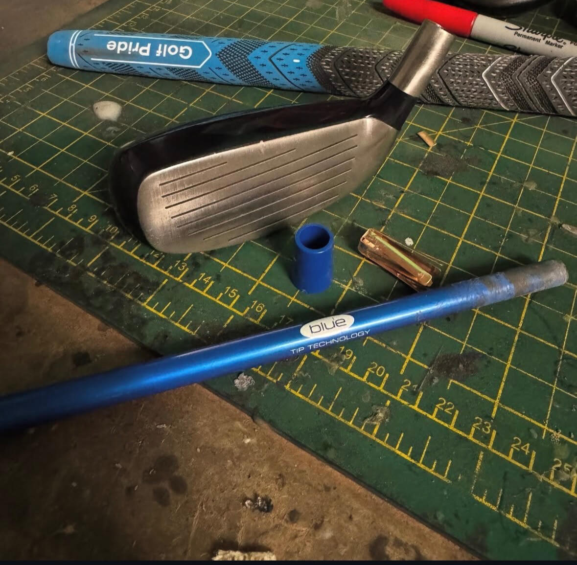 Sonartec club head, grip, shaft and shim laid out on the workbench ready for a custom build.